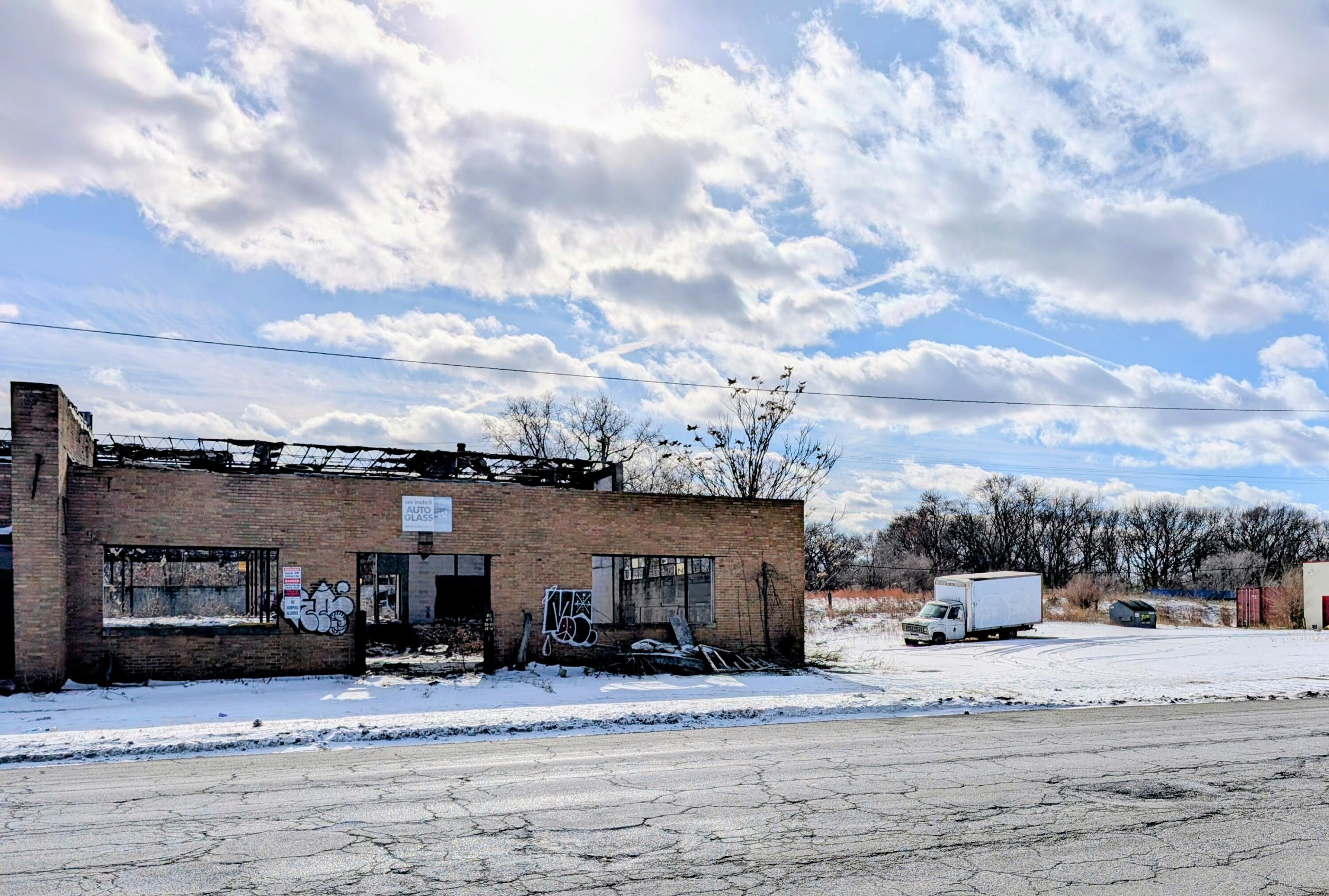 1301 West Ridge Road Gary, IN 46408 - Photo 3 of 5 a view of a house with snow on the background