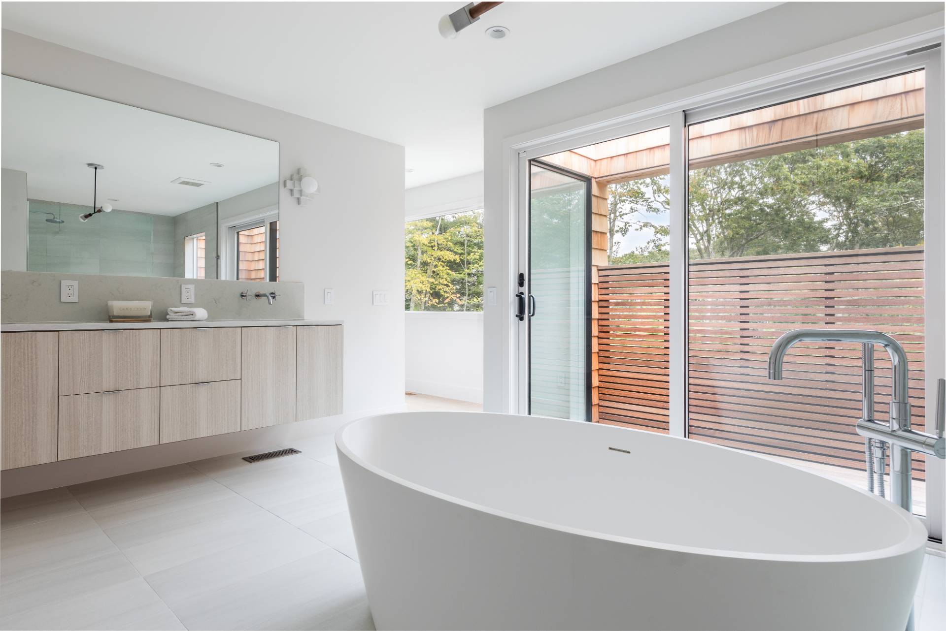 2 Semaphore Road East Hampton, NY 11937 - Photo 19 of 37 a bathroom with a bathtub and windows