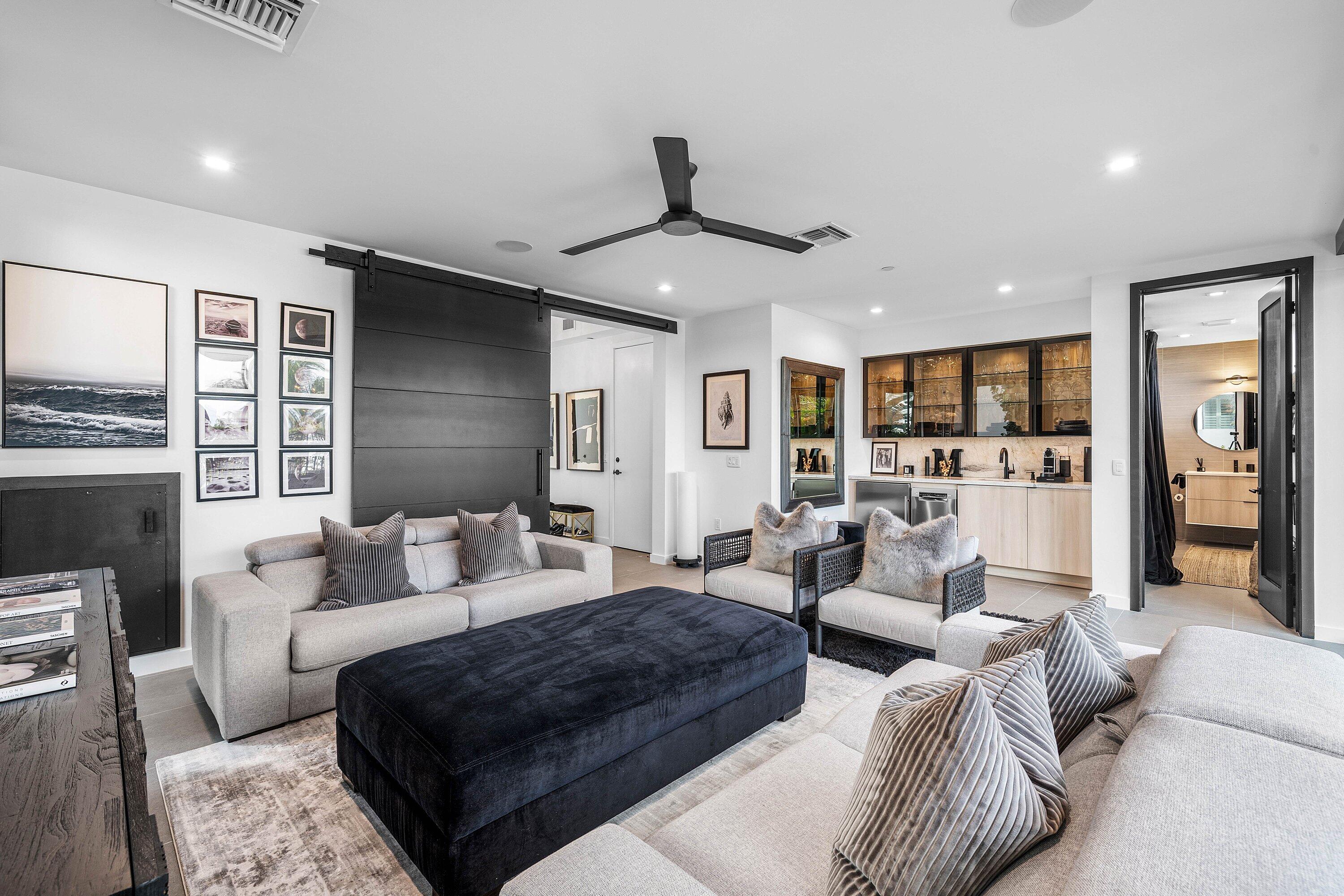 11501 Old Ocean Boulevard Ocean Ridge, FL 33435 - Photo 10 of 70 a living room with furniture and a chandelier