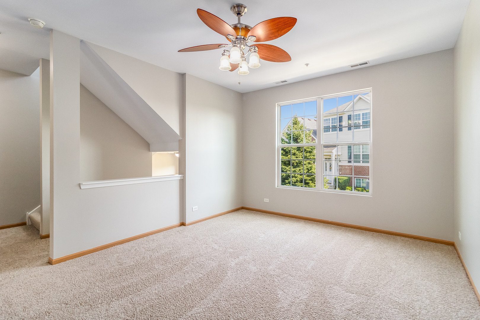 3863 Bailey Road Yorkville, IL 60560 - Photo 3 of 20 an empty room with windows and fan