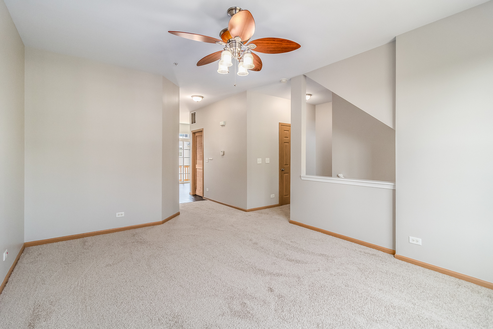 3863 Bailey Road Yorkville, IL 60560 - Photo 4 of 20 an empty room with chandelier fan and kitchen view