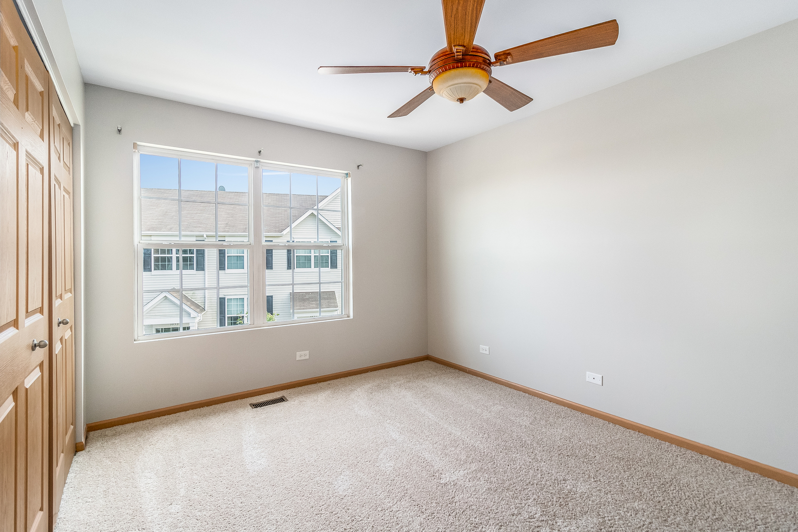 3863 Bailey Road Yorkville, IL 60560 - Photo 10 of 20 an empty room with windows and fan