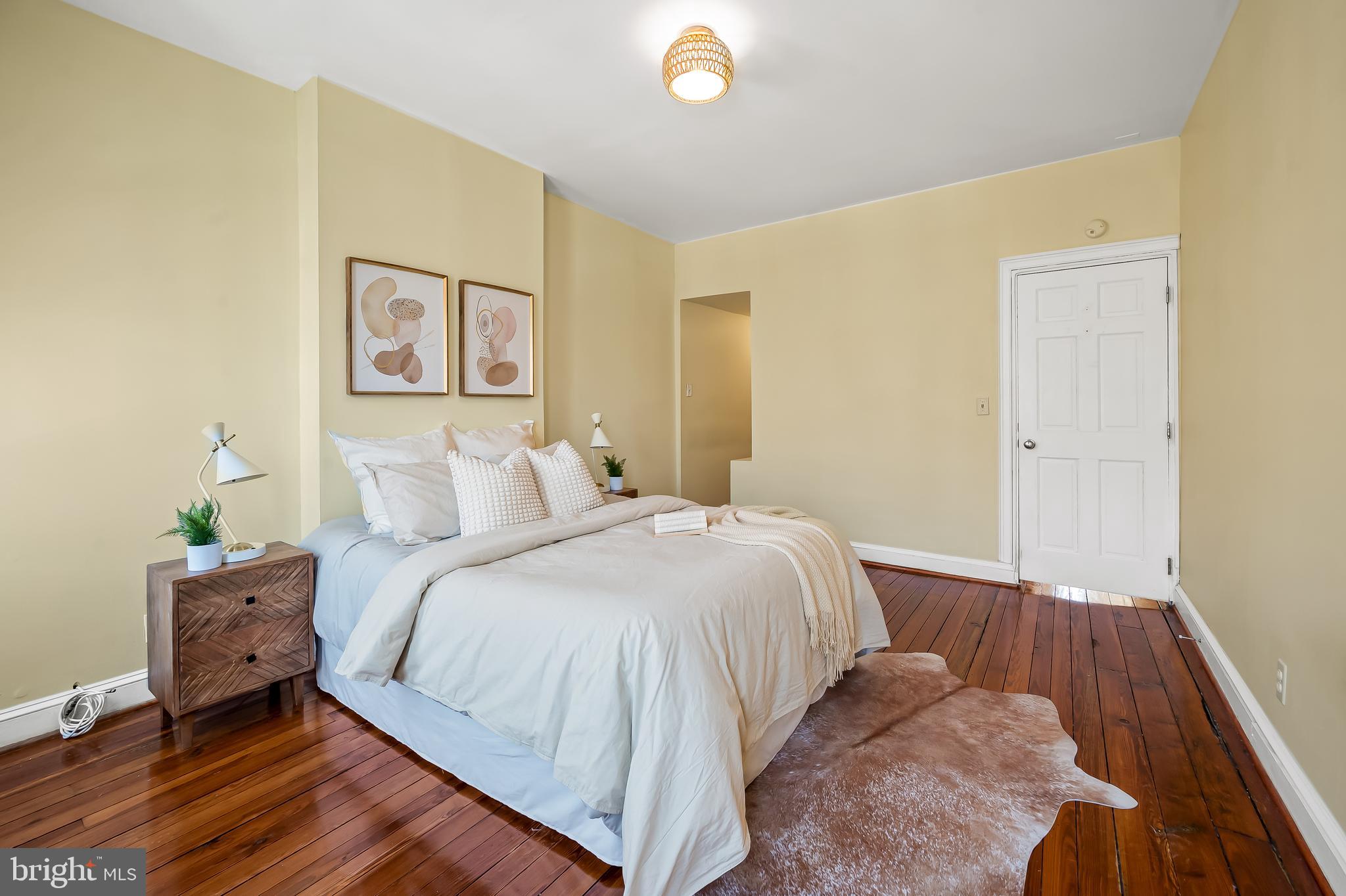 1045 Riverside Avenue Baltimore, MD 21230 - Photo 20 of 32 a bedroom with a bed and painting on the wall