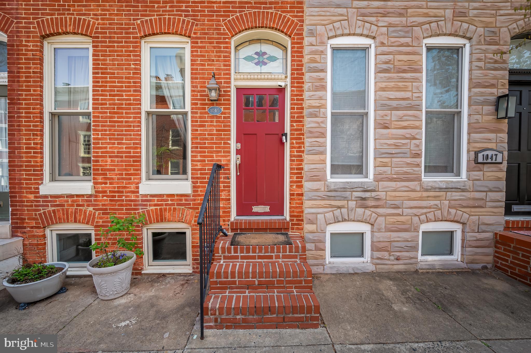 1045 Riverside Avenue Baltimore, MD 21230 - Photo 2 of 32 a front view of a house with a yard