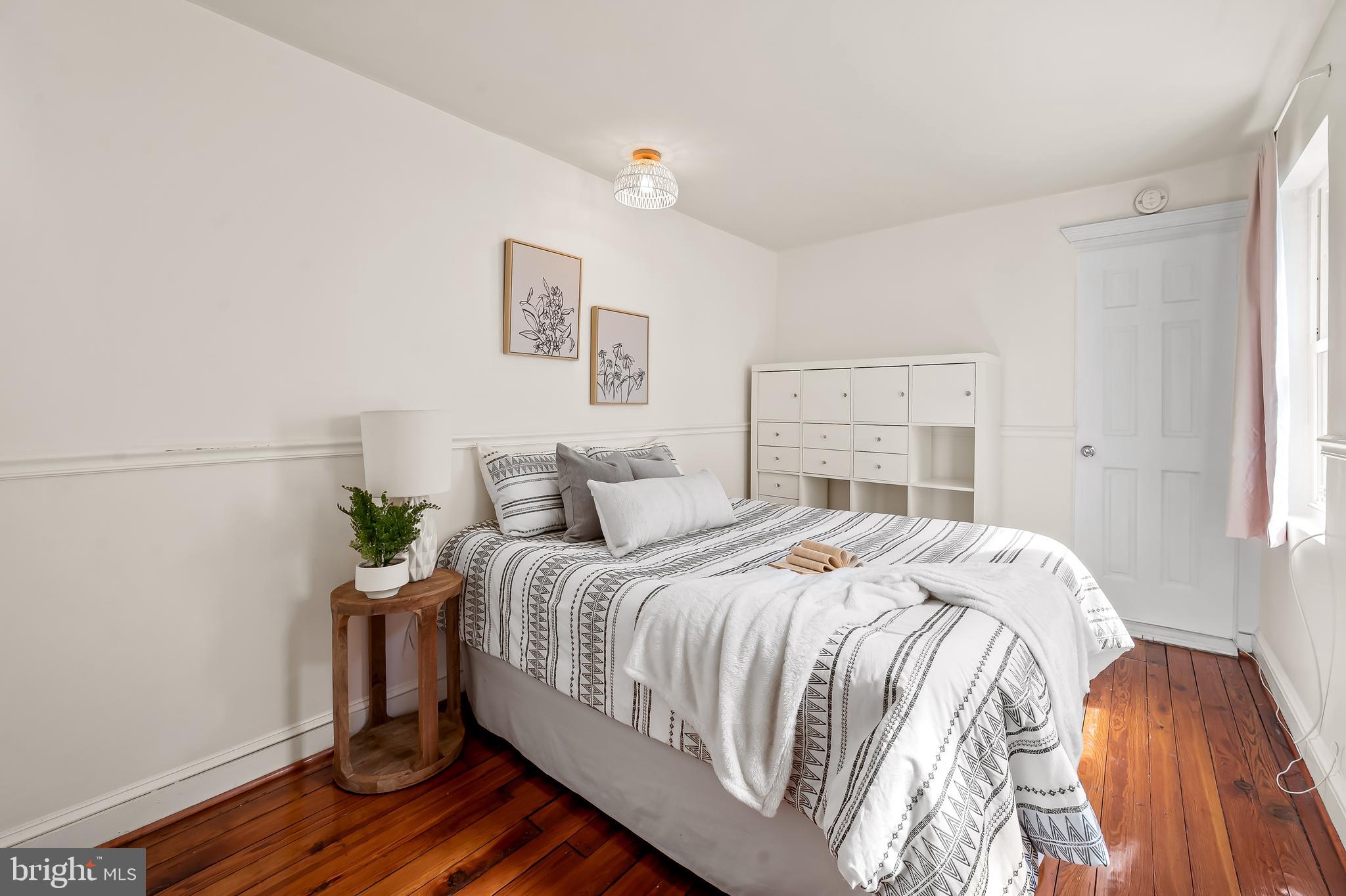 1045 Riverside Avenue Baltimore, MD 21230 - Photo 26 of 32 a bedroom with a bed and a window
