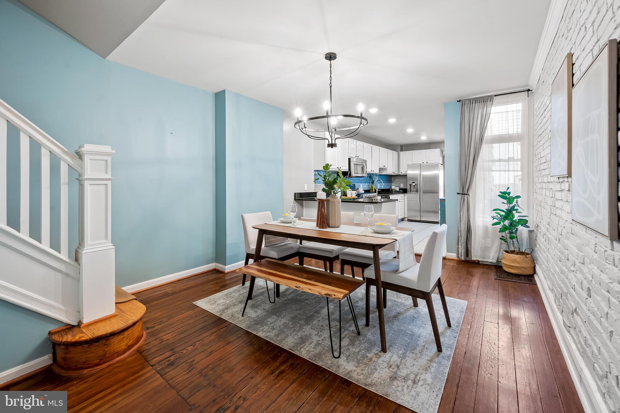 1045 Riverside Avenue Baltimore, MD 21230 - Photo 5 of 32 a view of a dining room with furniture window and wooden floor