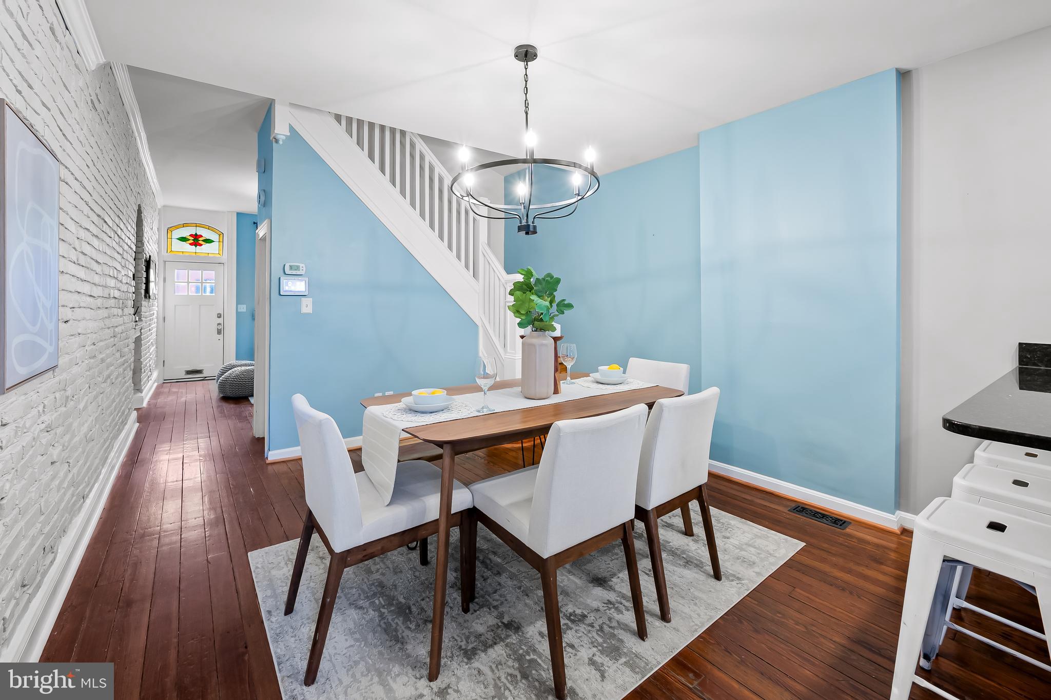 1045 Riverside Avenue Baltimore, MD 21230 - Photo 6 of 32 a view of a dining room with furniture wooden floor and chandelier