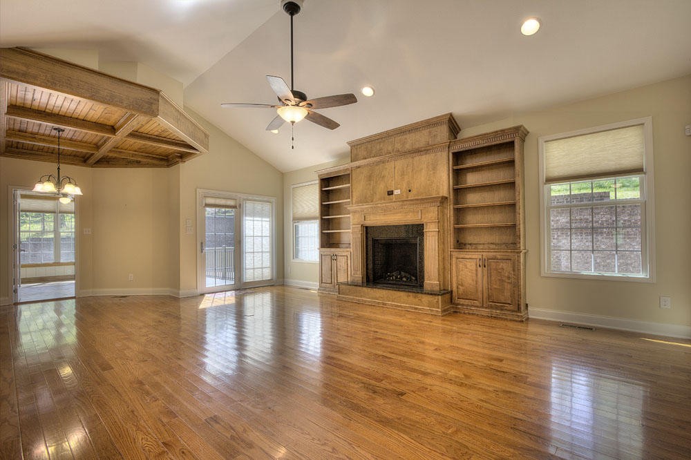 1400 Grimes Road Loudon, TN 37774 - Photo 11 of 32 a view of empty room with wooden floor and fireplace