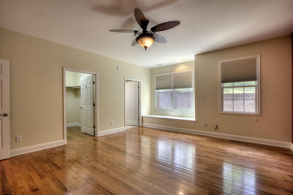 1400 Grimes Road Loudon, TN 37774 - Photo 20 of 32 a view of empty room with wooden floor and fan