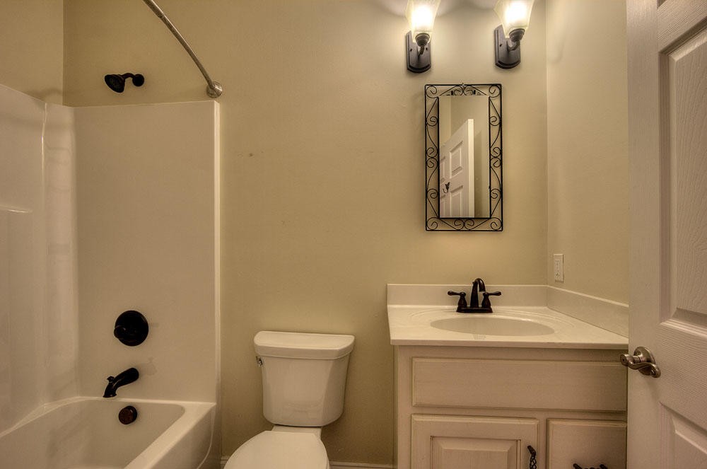1400 Grimes Road Loudon, TN 37774 - Photo 27 of 32 a bathroom with a toilet sink and mirror