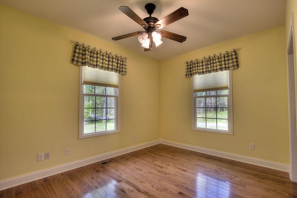 1400 Grimes Road Loudon, TN 37774 - Photo 28 of 32 a view of an empty room with a window and wooden floor