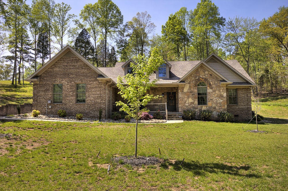 1400 Grimes Road Loudon, TN 37774 - Photo 5 of 32 a front view of a house with a yard