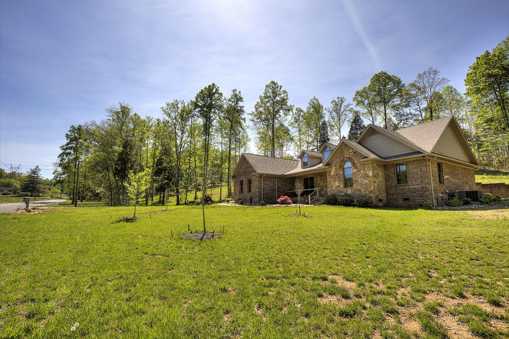 1400 Grimes Road Loudon, TN 37774 - Photo 7 of 32 a house view with a garden space