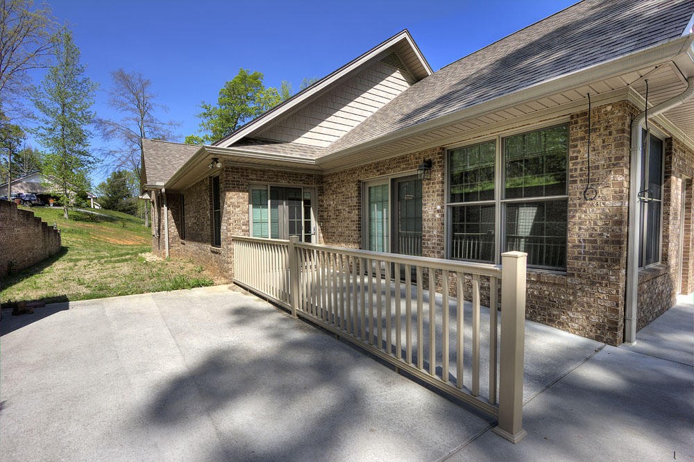 1400 Grimes Road Loudon, TN 37774 - Photo 9 of 32 a view of a house with backyard and porch