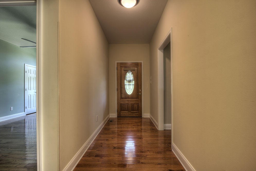 1400 Grimes Road Loudon, TN 37774 - Photo 10 of 32 a view of a hallway with wooden floor