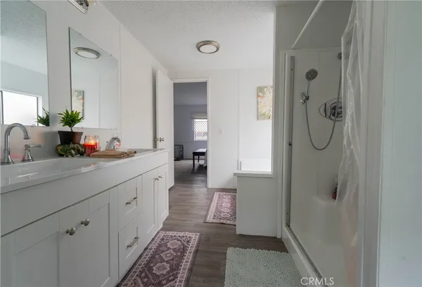 a bathroom with a bathtub sink and window