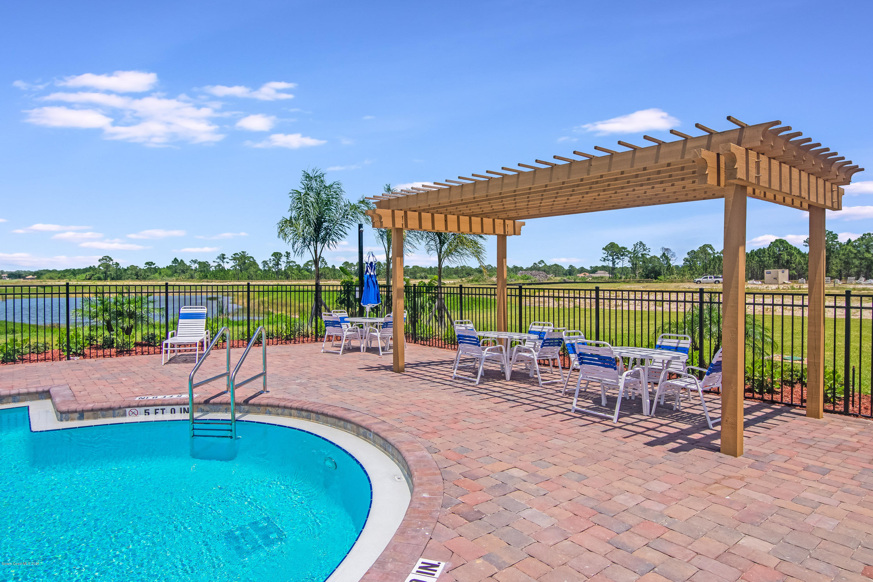 519 Old Country Rd S East Palm Bay, FL 32909 - Photo 24 of 29 a view of a swimming pool with a patio
