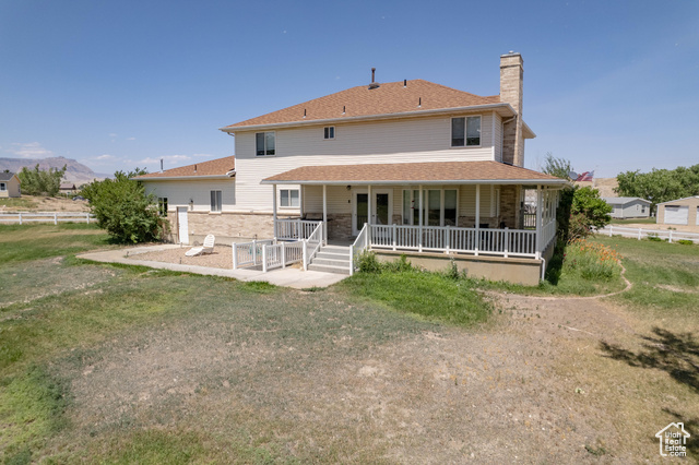 190 600 North Ferron, UT 84523 - Photo 75 of 85 Rear view of property with a chimney and a porch
