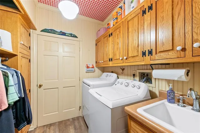 a bathroom with a sink a toilet and a shower