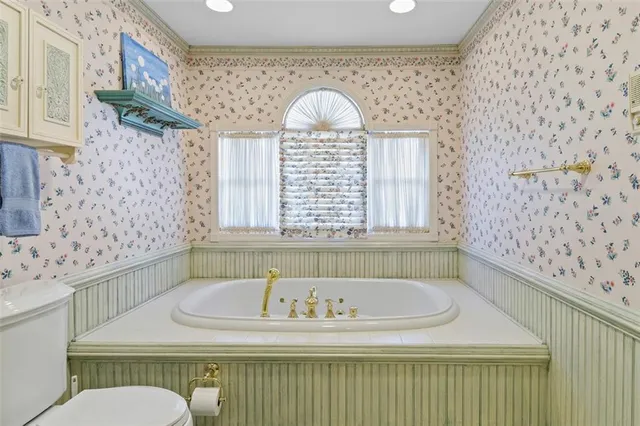 a bathroom with a bathtub and a sink