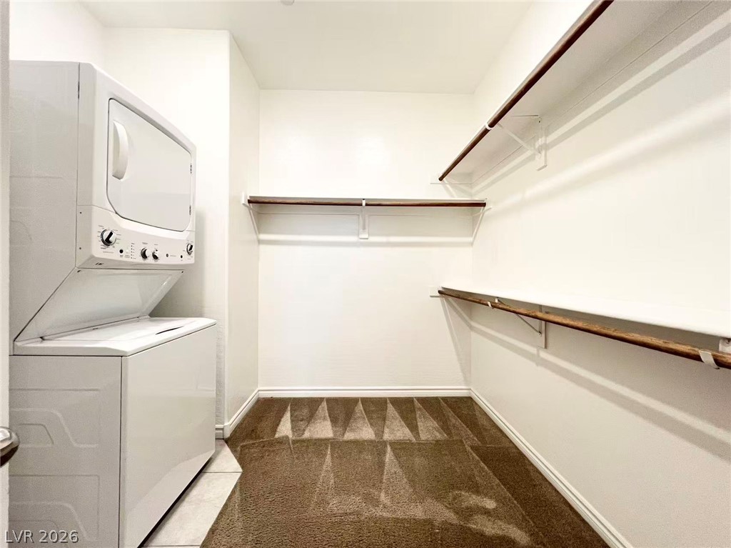 925 Bayberry Ridge Street Henderson, NV 89052 - Photo 10 of 27 A well-organized laundry closet offers practical space and efficient appliance integration.
