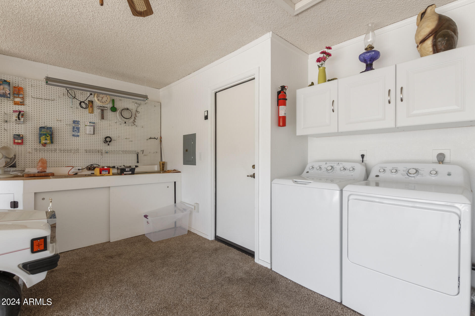 1021 South Greenfield Road, Unit 1058 Mesa, AZ 85206 - Photo 13 of 14 a view of storage and utility room with cabinets