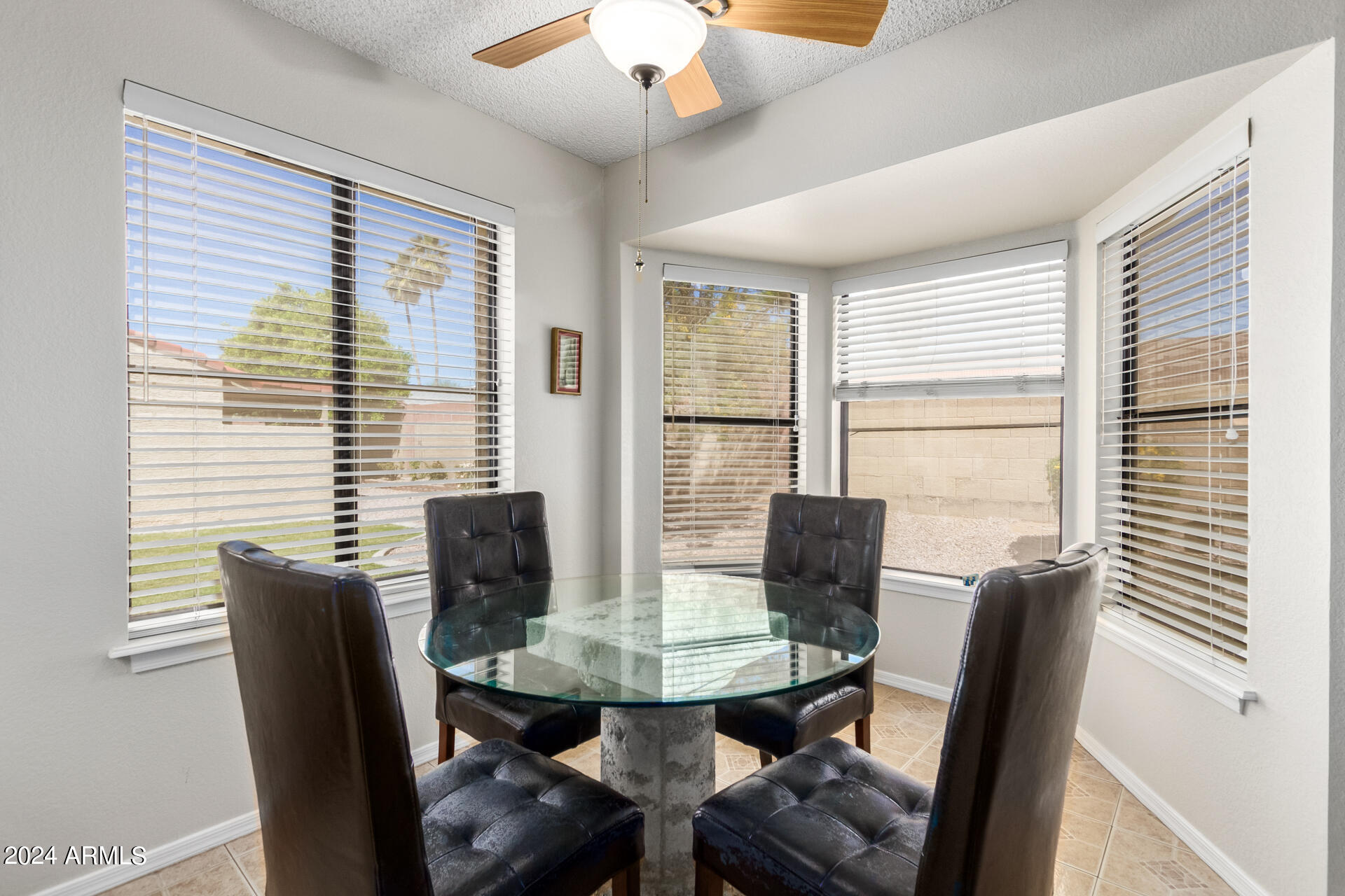 1021 South Greenfield Road, Unit 1058 Mesa, AZ 85206 - Photo 4 of 14 a view of a dining room with furniture and window