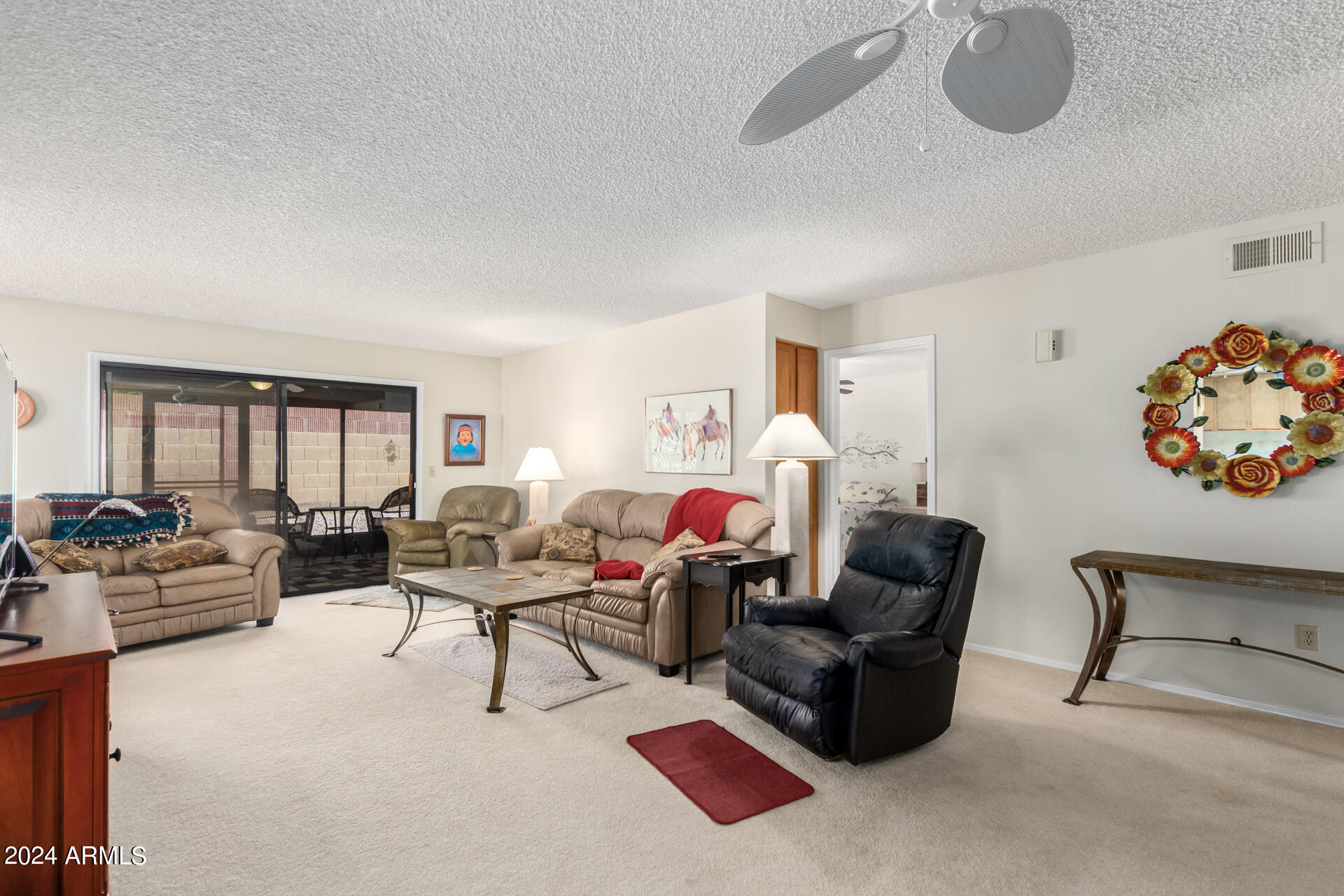 1021 South Greenfield Road, Unit 1058 Mesa, AZ 85206 - Photo 5 of 14 a living room with furniture and a large window