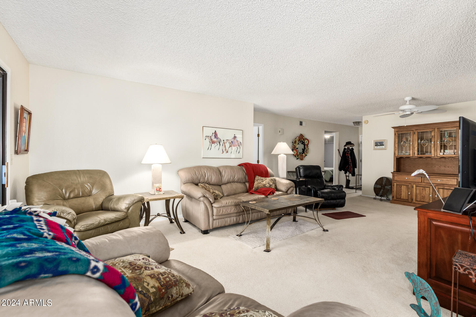 1021 South Greenfield Road, Unit 1058 Mesa, AZ 85206 - Photo 6 of 14 a living room with furniture and a couch