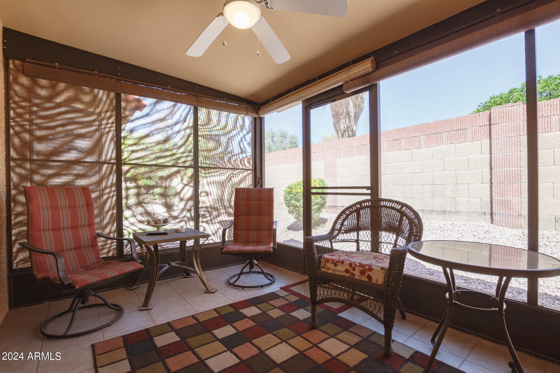 1021 South Greenfield Road, Unit 1058 Mesa, AZ 85206 - Photo 7 of 14 a living room with furniture and a floor to ceiling window
