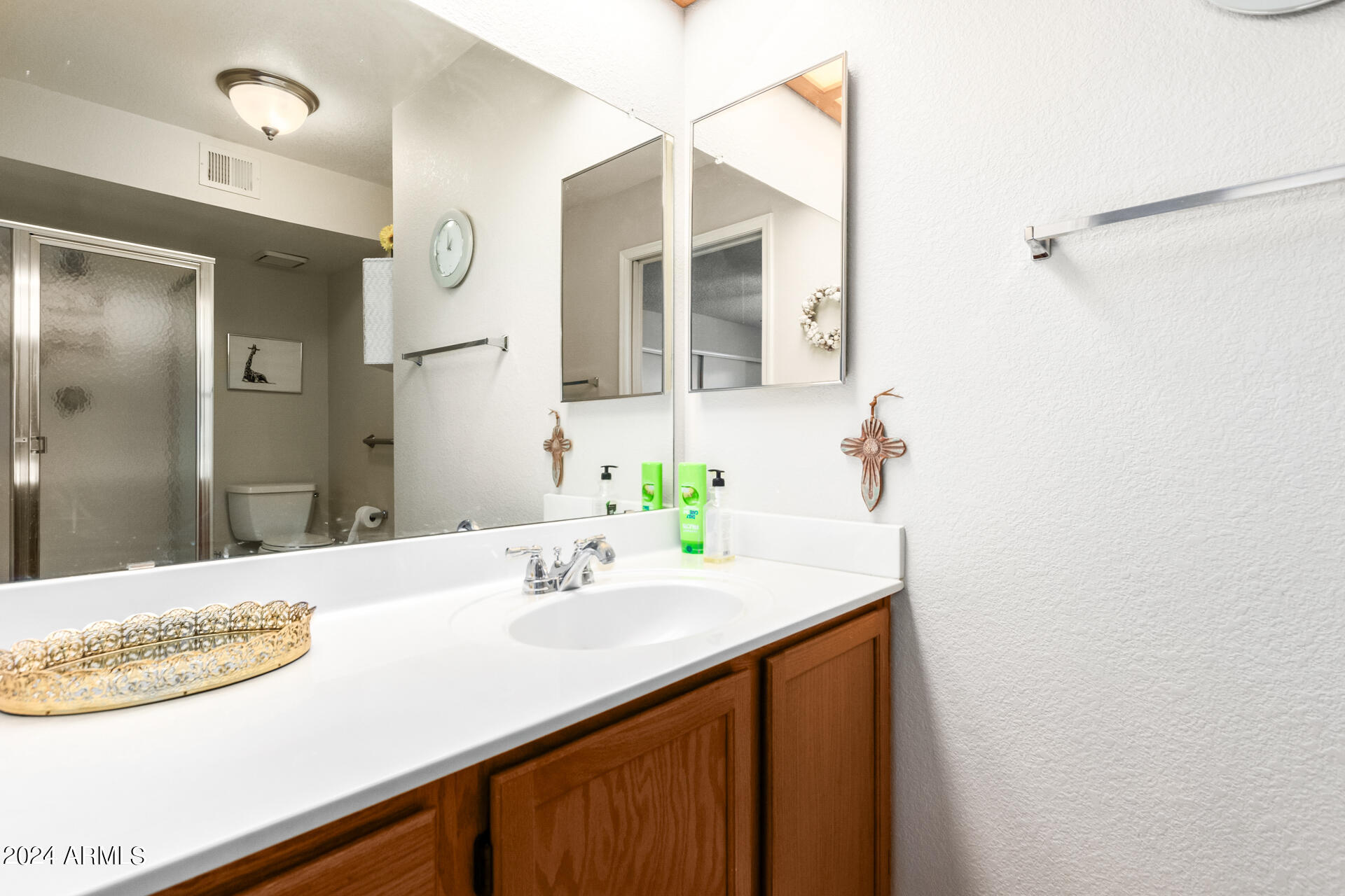 1021 South Greenfield Road, Unit 1058 Mesa, AZ 85206 - Photo 10 of 14 a bathroom with a sink and a mirror