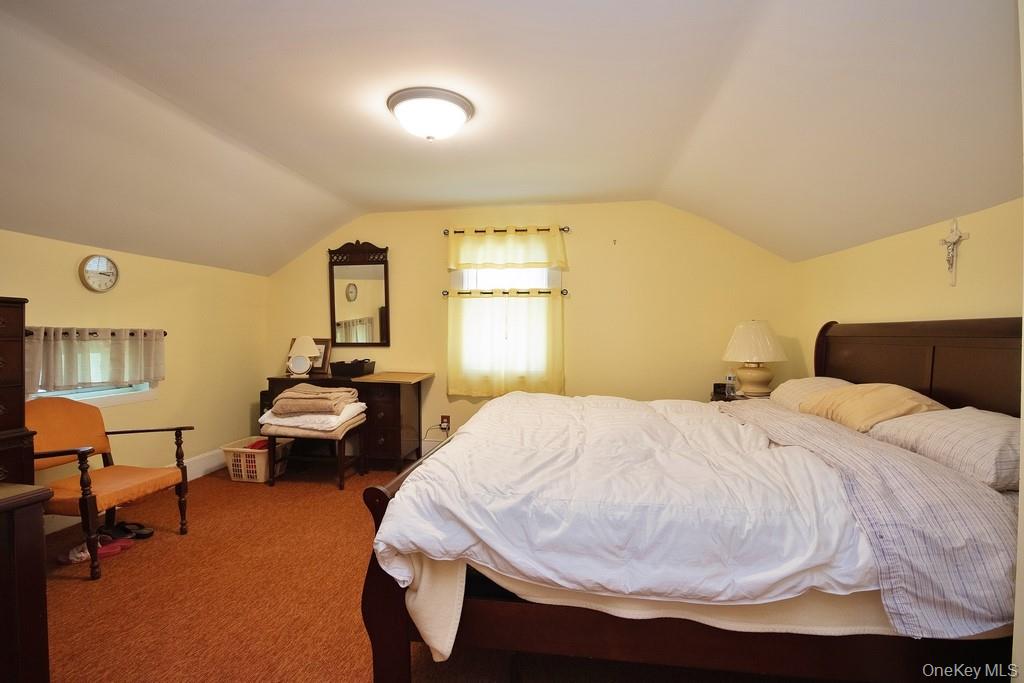 169 Mitchell Pond E Road Cochecton, NY 12726 - Photo 19 of 33 a bedroom with a bed and window