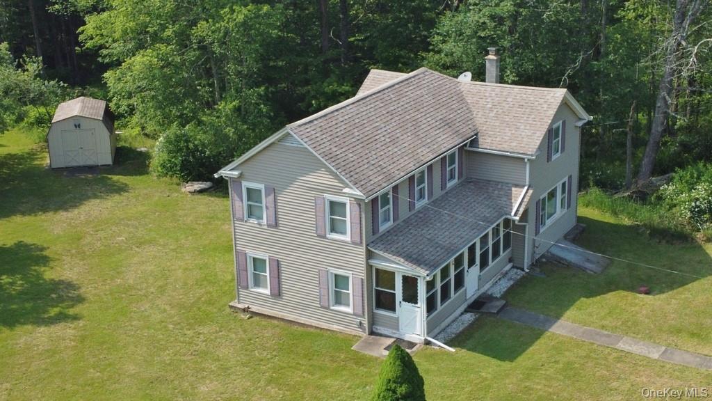 169 Mitchell Pond E Road Cochecton, NY 12726 - Photo 2 of 33 an aerial view of residential house with swimming pool and trees in the background