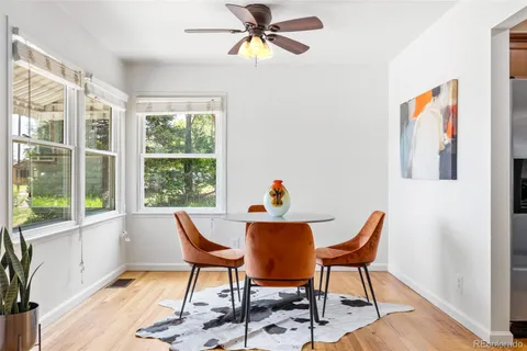 a dining room with furniture and window