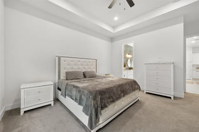 a bedroom with a bed and a dresser