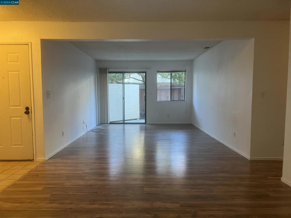 5075 Valley Crest Drive Concord, CA 94521 - Photo 8 of 20 a view of room with window and wooden floor