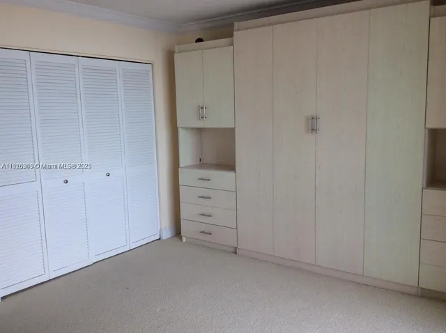 a view of an empty walk in closet