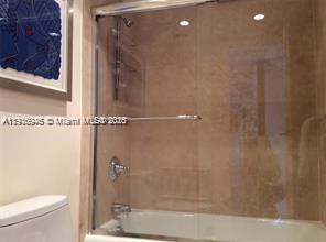 2333 Brickell Avenue, Unit 2215 Miami, FL 33129 - Photo 8 of 27 a bathroom with a shower and a toilet