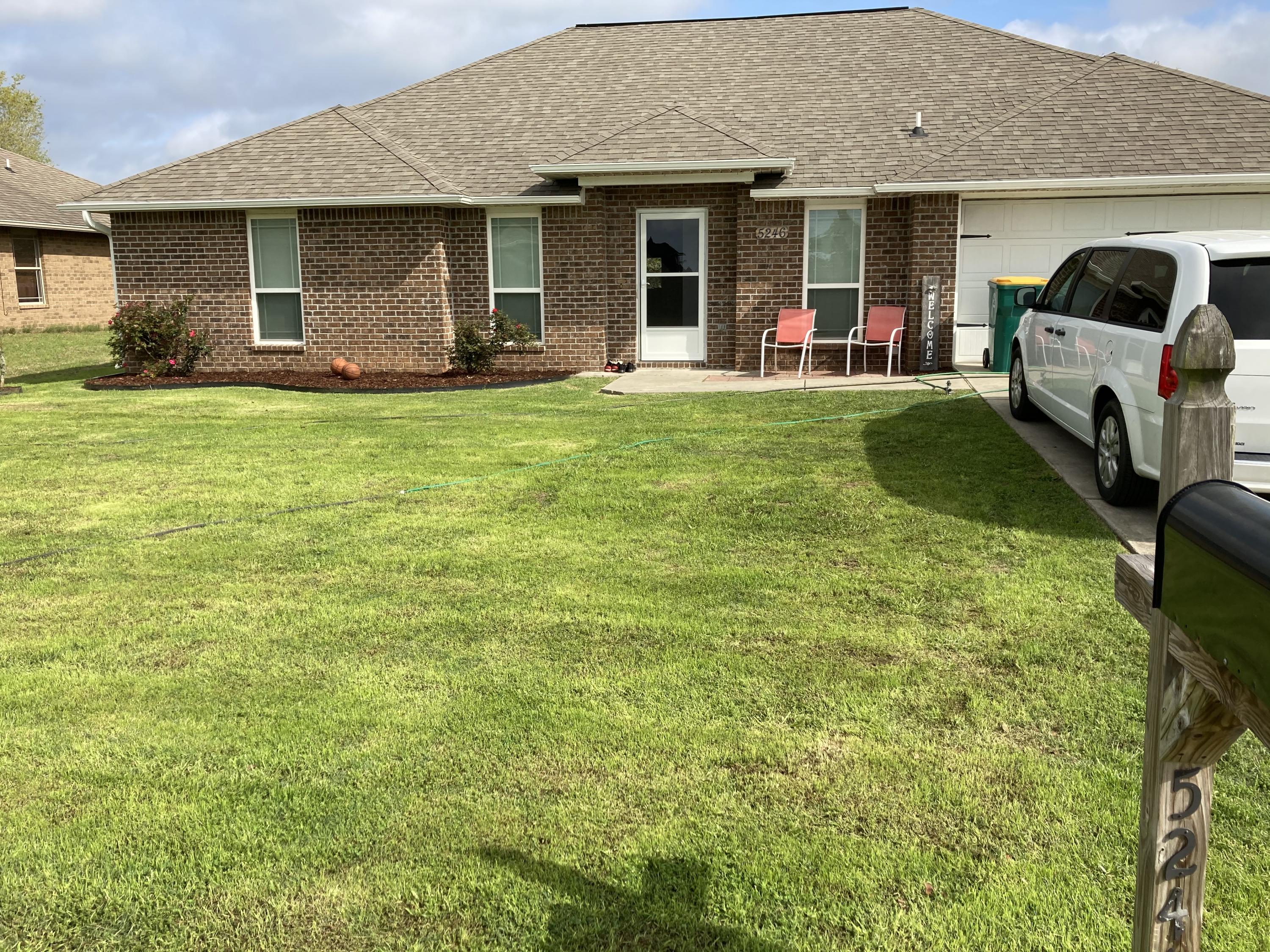 5246 Moore Loop Crestview, FL 32536 - Photo 1 of 7 a view of a house with a yard and sitting area