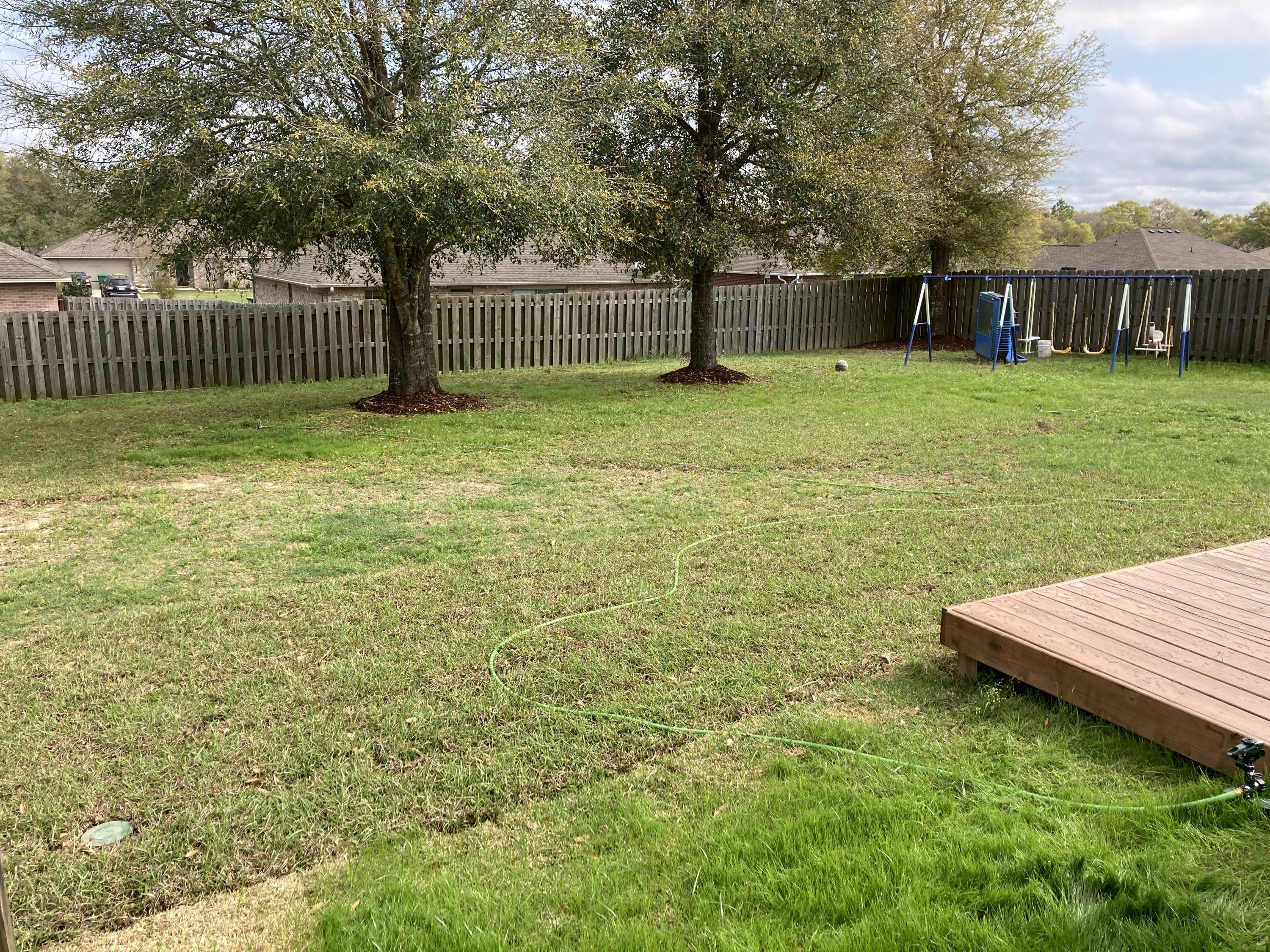 5246 Moore Loop Crestview, FL 32536 - Photo 5 of 7 a view of a house with backyard and a tree