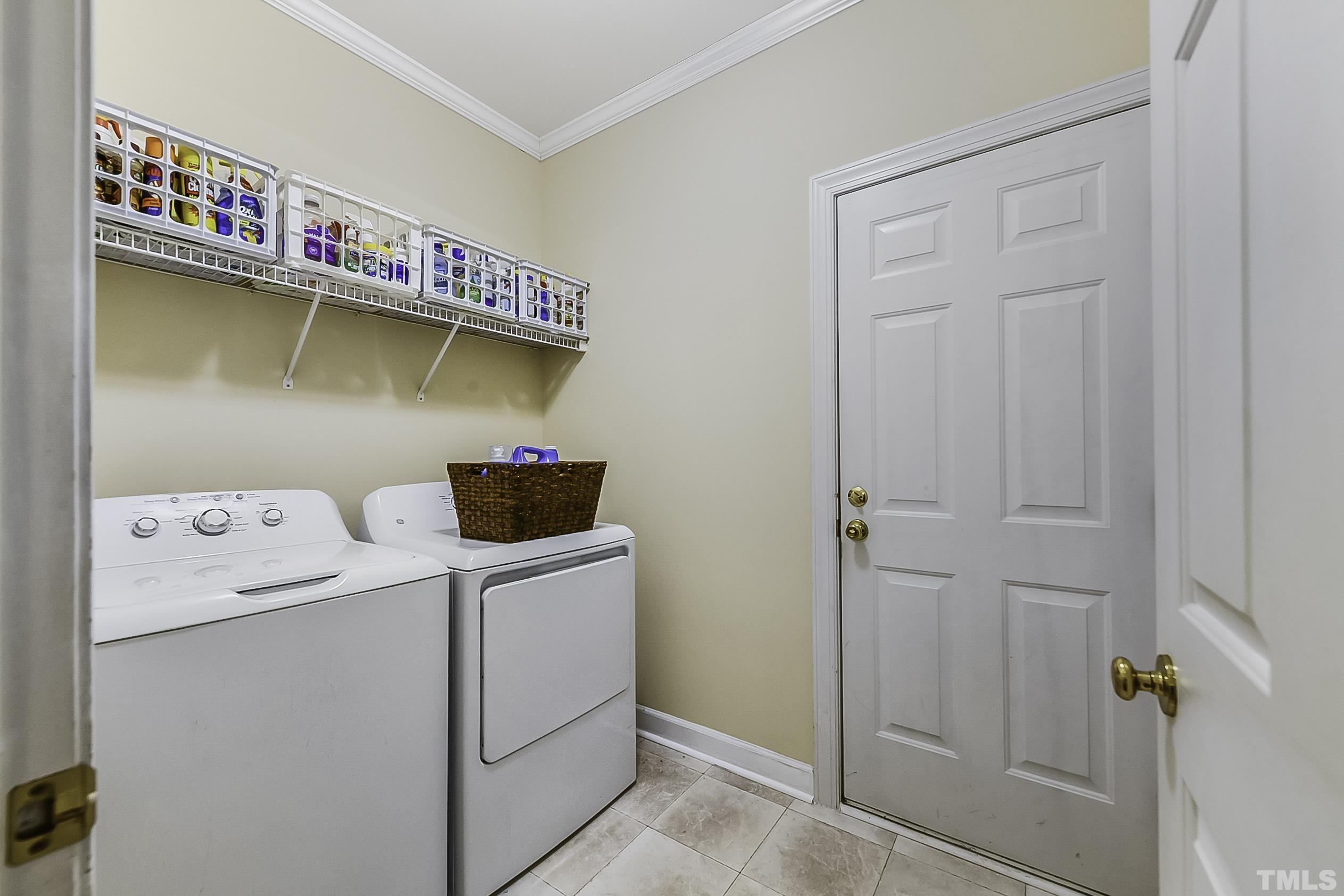 7929 Milltrace Run Raleigh, NC 27615 - Photo 22 of 36 a utility room with dryer and washer