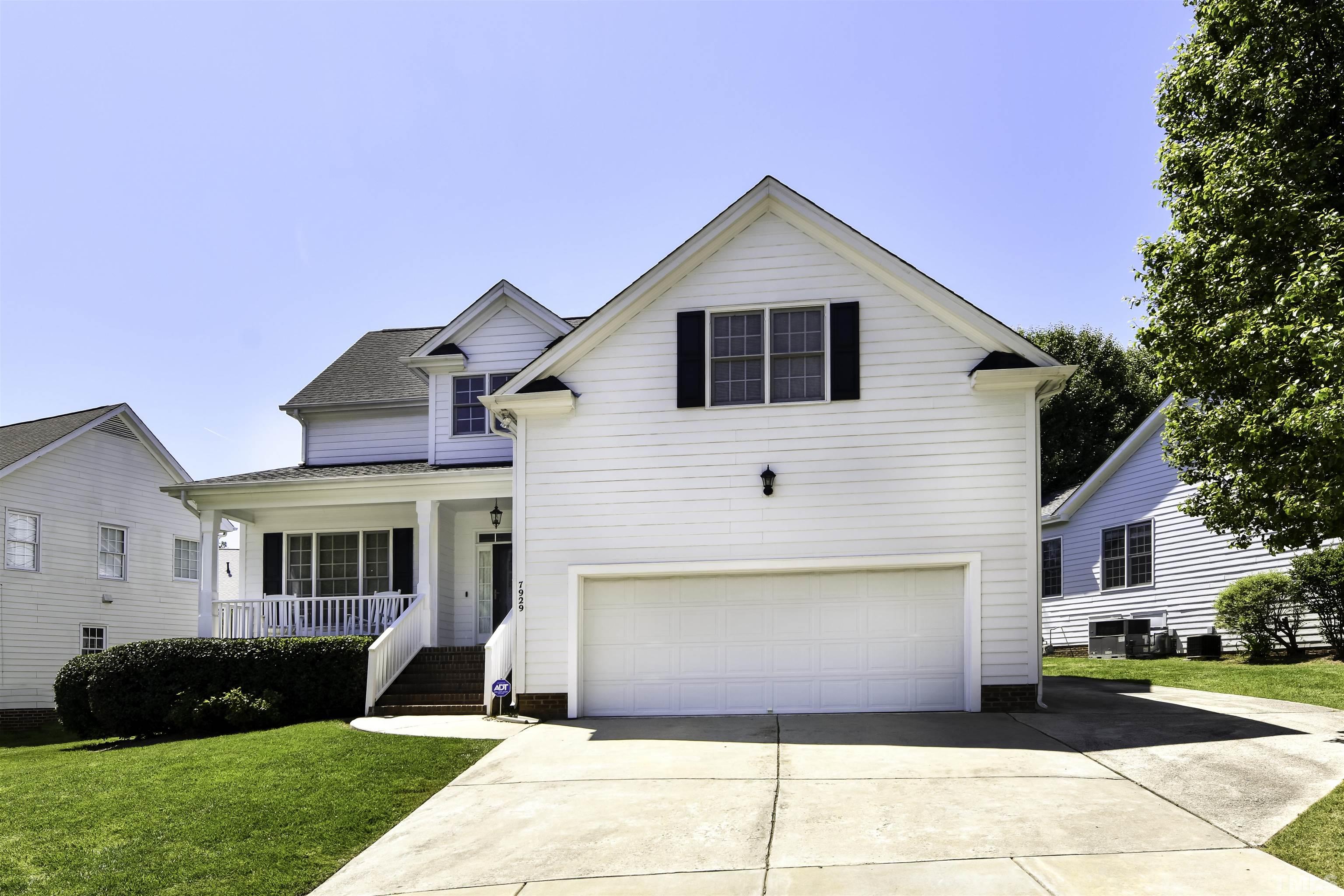 7929 Milltrace Run Raleigh, NC 27615 - Photo 3 of 36 a front view of a house with a yard