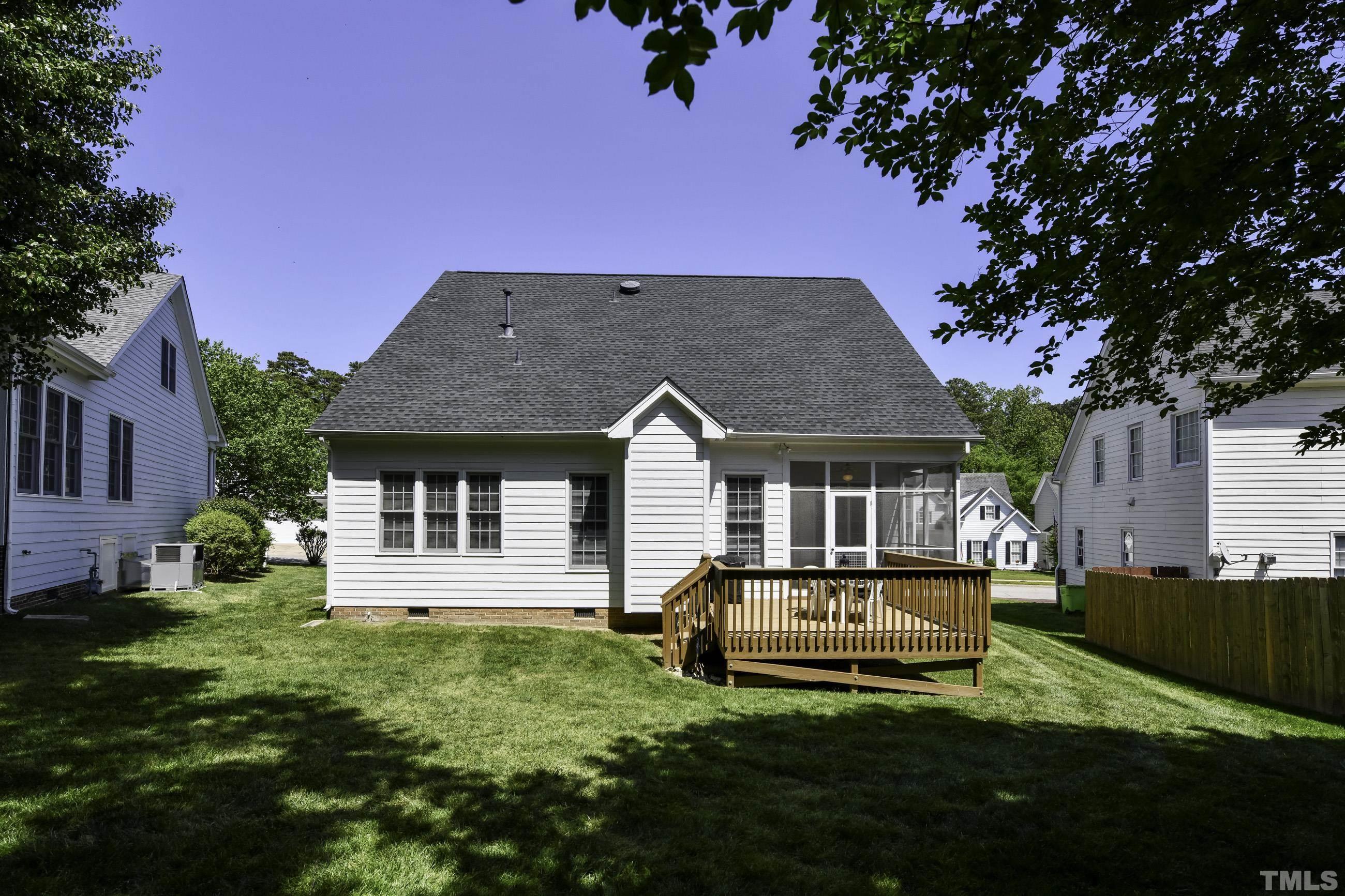 7929 Milltrace Run Raleigh, NC 27615 - Photo 33 of 36 a front view of a house with a garden