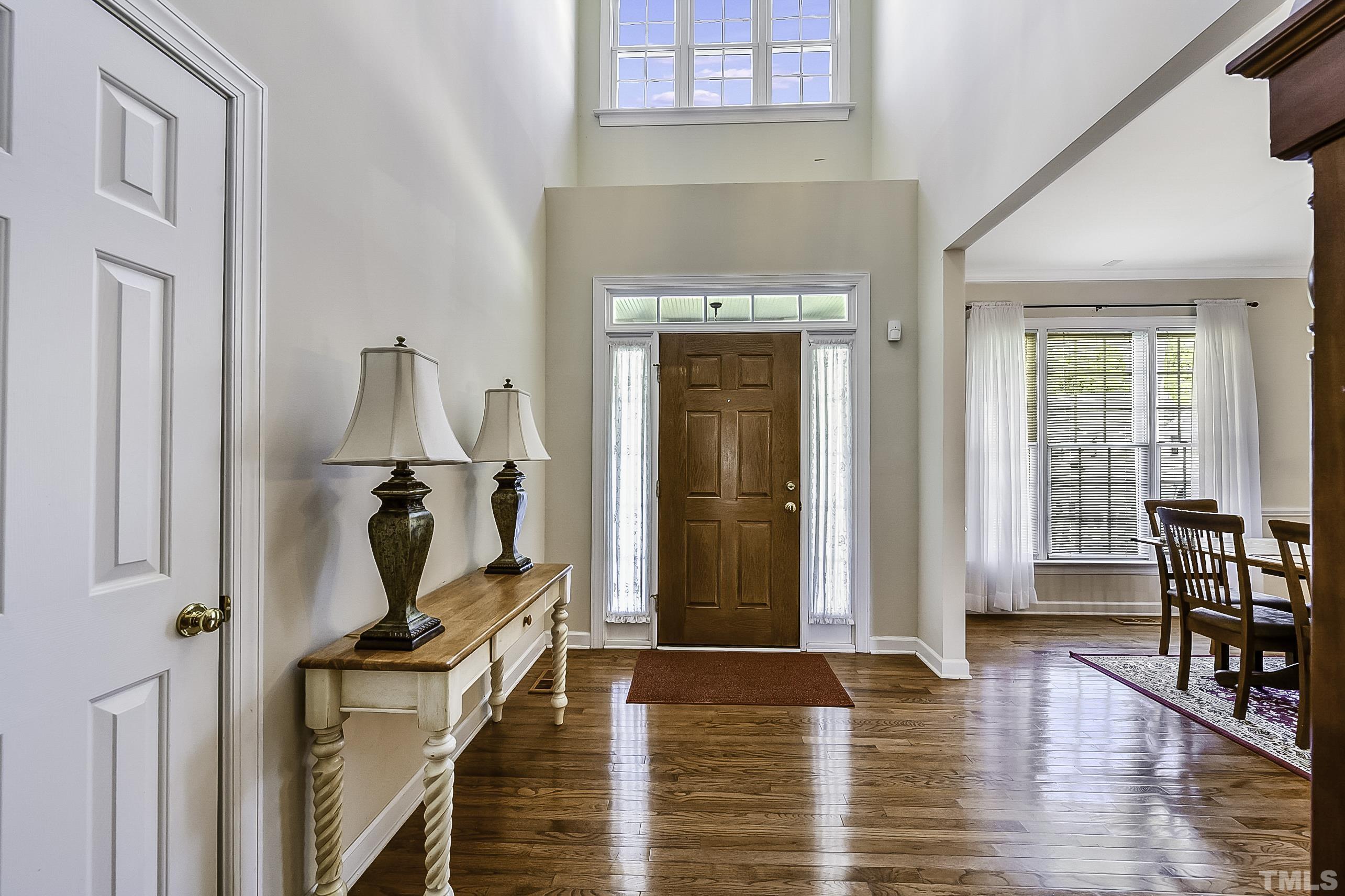 7929 Milltrace Run Raleigh, NC 27615 - Photo 5 of 36 a view of a livingroom with furniture and hardwood floor