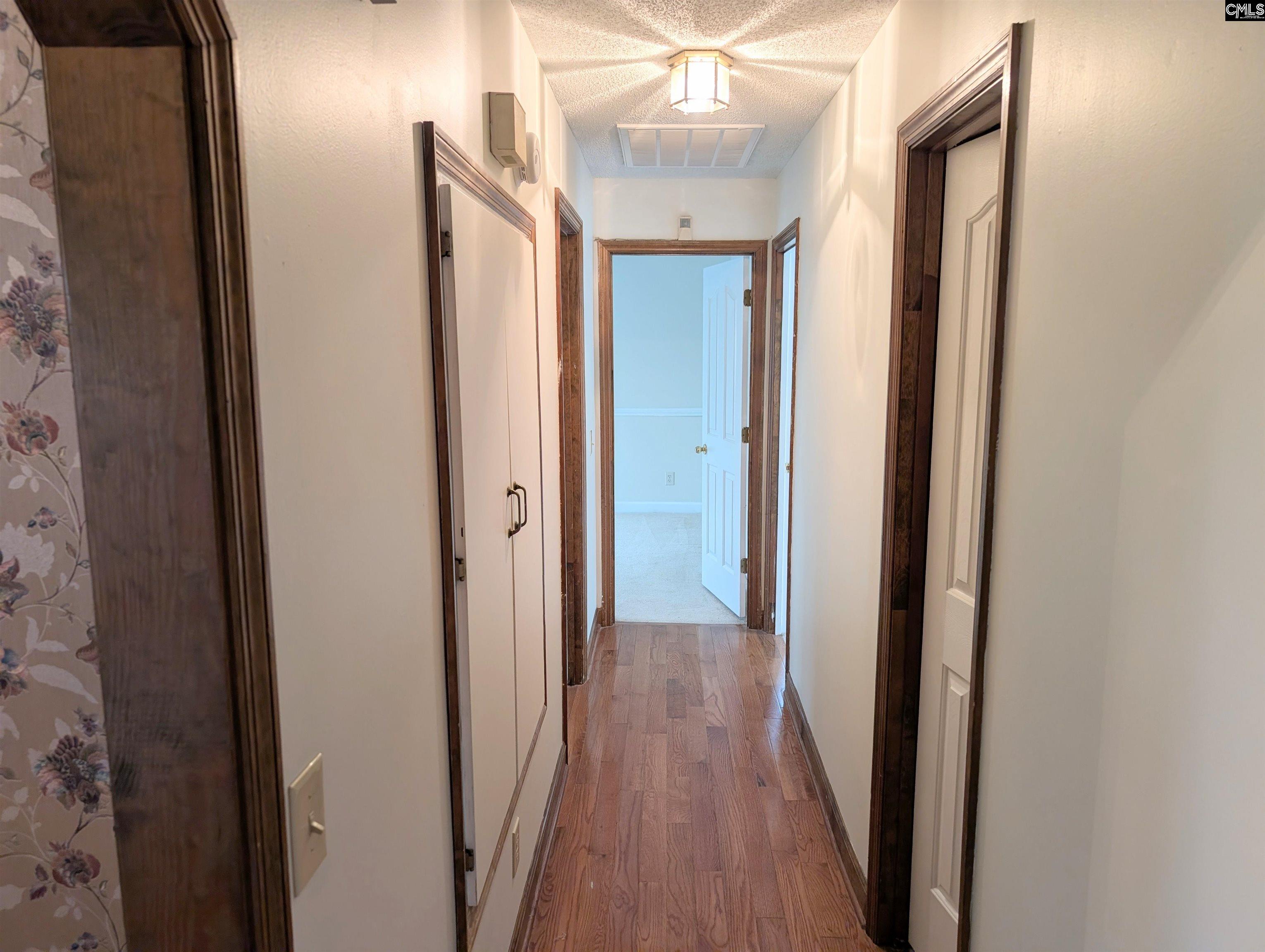 100 Welsh Court Lexington, SC 29073 - Photo 10 of 27 a view of a hallway with wooden floor
