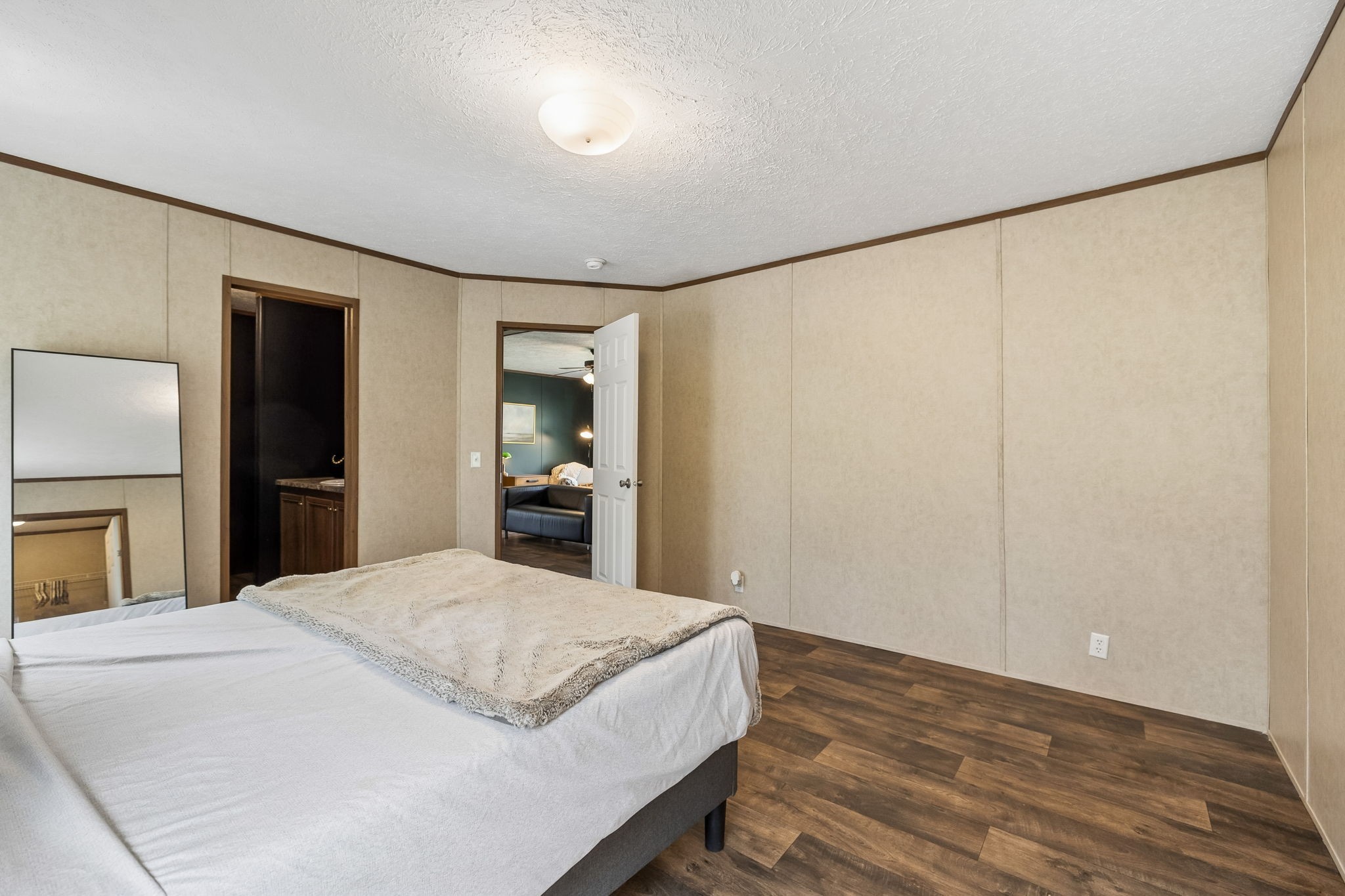 805 Harris Road Dickson, TN 37055 - Photo 28 of 46 a bedroom with a large bed and a chandelier