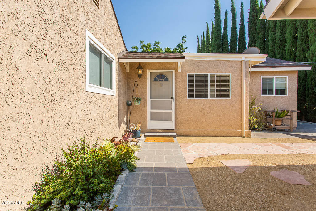 4123 Eve Road Simi Valley, CA 93063 - Photo 22 of 36 a view of a house with a yard and potted plants