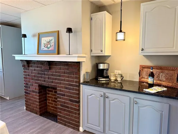 a kitchen with appliances cabinets and a counter top space