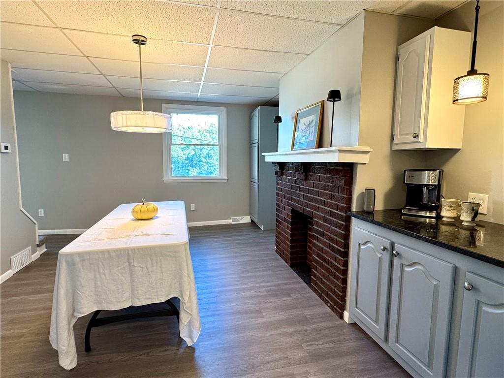 532 North Elm Street Butler, PA 16001 - Photo 15 of 31 a kitchen with kitchen island granite countertop a stove a sink and dishwasher wooden cabinets with wooden floor