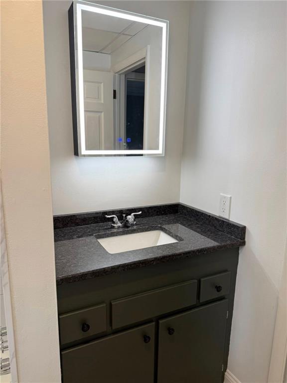 532 North Elm Street Butler, PA 16001 - Photo 17 of 31 a bathroom with a granite countertop sink and a mirror